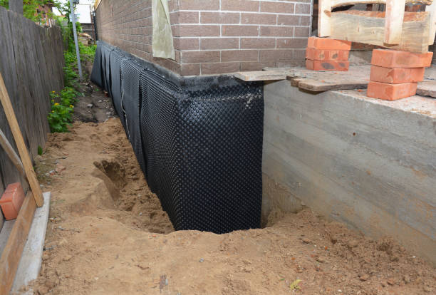 Happy homeowners after waterproofing job in Idlewild